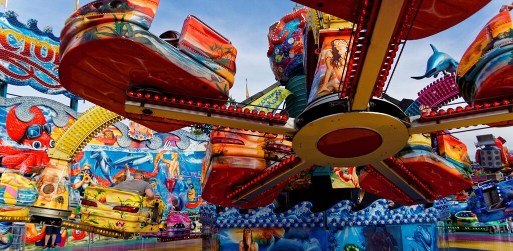a carnival ride with people riding on itamusement parks in San Diego
